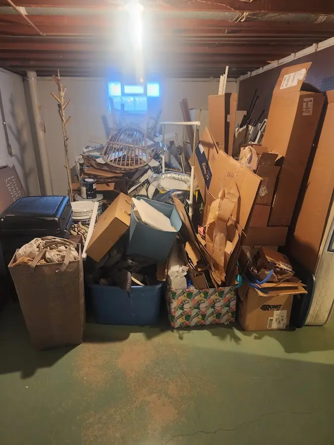 Roll-off dumpster container at job site for 2 Yard Dumpster Rental in Houghton